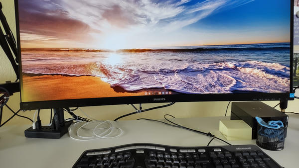Photo of a curved Display floating above the desk